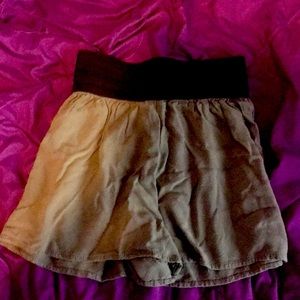 Pair of dark green shorts.